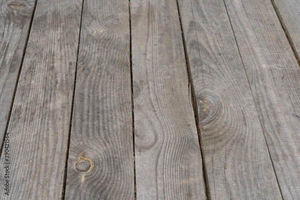 Fototapeta Closeup view photography of real wooden natural grey aged surface of rustic table with perspective angle shoot. Abstract wooden photo background.