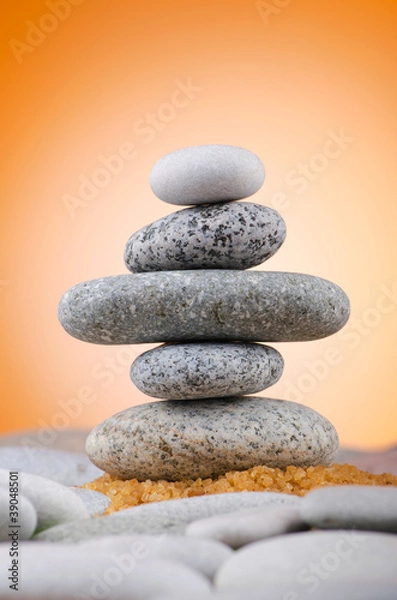 Fototapeta Balanced pebbles with colour background