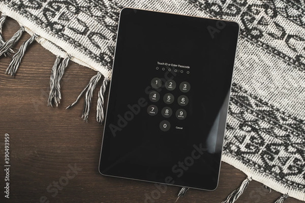 Obraz Digital Tablet on a wooden table.