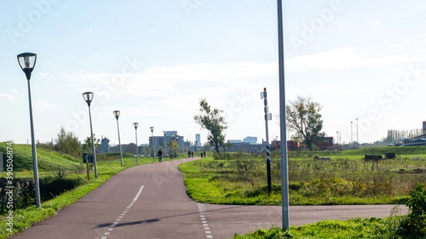 Fototapeta A bike path to the city in Nijmegen, the Netherlands