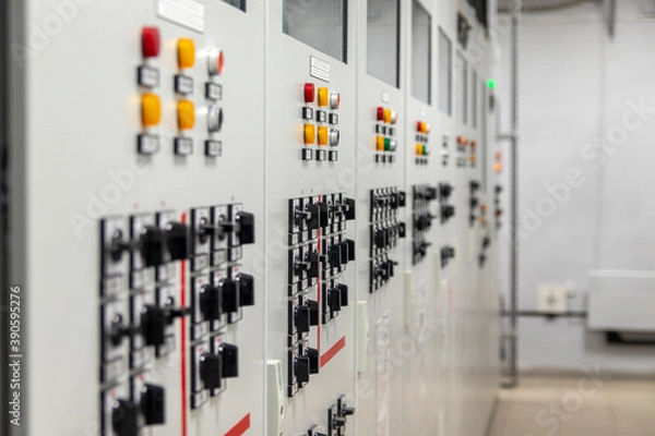 Fototapeta Power distribution device, Industrial power distribution panel for control, safety and protection system of a substation in a power plant. Selective focus.