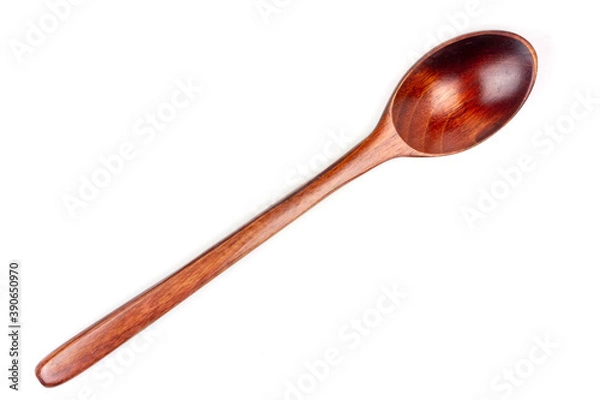 Fototapeta Close-up single wooden spoon isolated on white background.