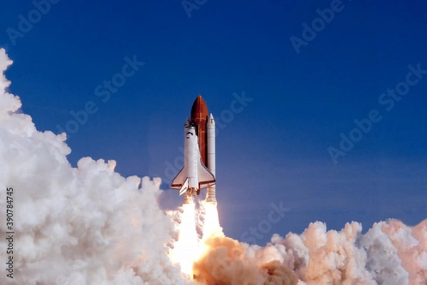 Fototapeta The launch of the space shuttle against the background of the sky and smoke. Elements of this image furnished by NASA