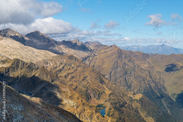 Obraz Views from the Sacroux peak (2676m) looking west into the Benasque valley in the Aragonese Pyrenees a blue sky and withe clouds day.
