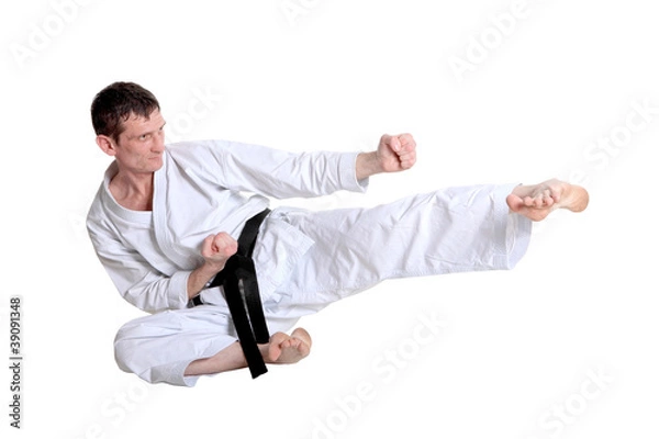 Obraz Karate jump against white background