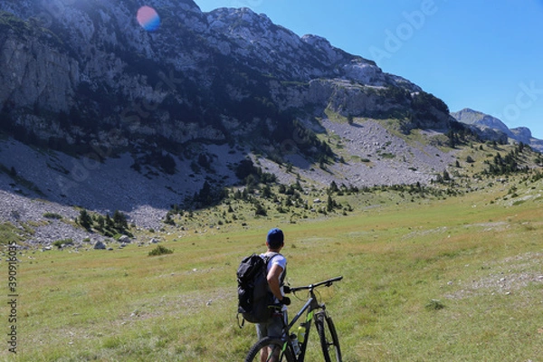 Fototapeta mountain biking in the mountains