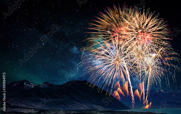 Fototapeta Colorful of fireworks display on milkyway in night sky background.