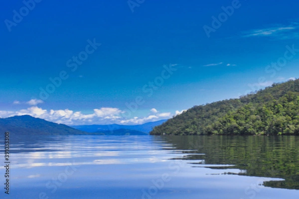 Obraz Island with Blue Sky Background