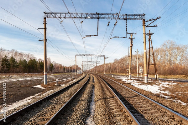 Fototapeta Two-track. electrified railway stretching into the distance