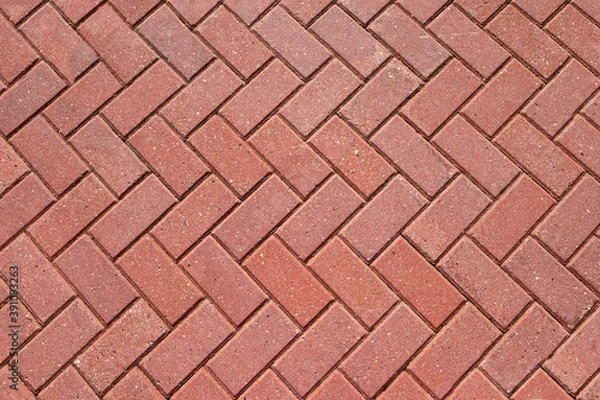Fototapeta Abstract background from paving red tiles, bricks. Top view of the pavement pattern. Concept for construction, urban environment improvement, finishing works, landscape design