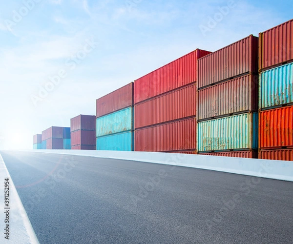 Fototapeta Containers on the wharf. International shipping logistics.