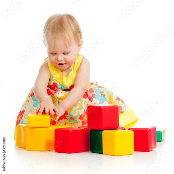 Fototapeta little girl playing with building blocks