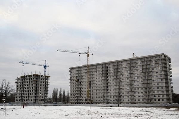 Obraz Construction site with cranes in winter