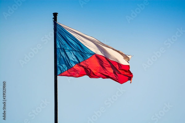 Fototapeta Prague, Czech republic - September 19, 2020. Flag of Czechia flying in the wind on the blue sky