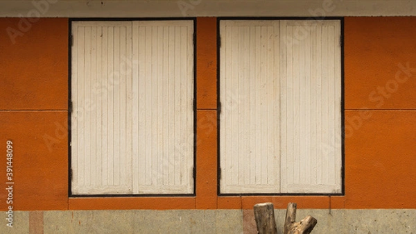 Obraz two wood windows on red brick wall