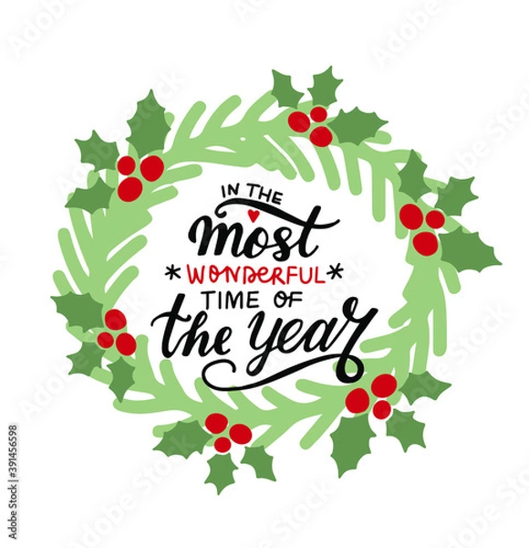 Fototapeta In the most wonderful time of the year. Christmas wreathe and hand lettering holiday greeting quote. Modern calligraphy. Congrats cards design element. Xmas phrase