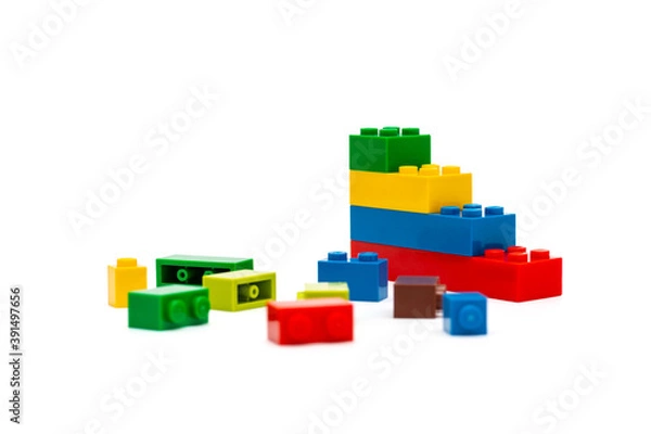 Obraz Multi-colored plastic building blocks. Toys and games. Focus in the background.