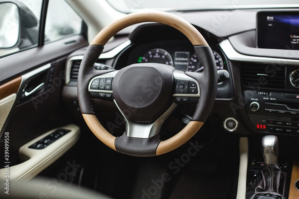 Fototapeta Interior view of car, luxury car steering wheel and dashboard with display or monitor screen.