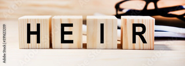 Fototapeta Text on wooden heir cubes, glasses and reports in the background.