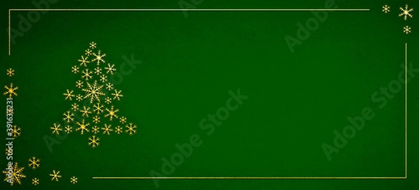 Fototapeta Christmas decorations with golden snowflakes shape and Christmas tree on a dark green background. Decorative background with frame and copy space.
