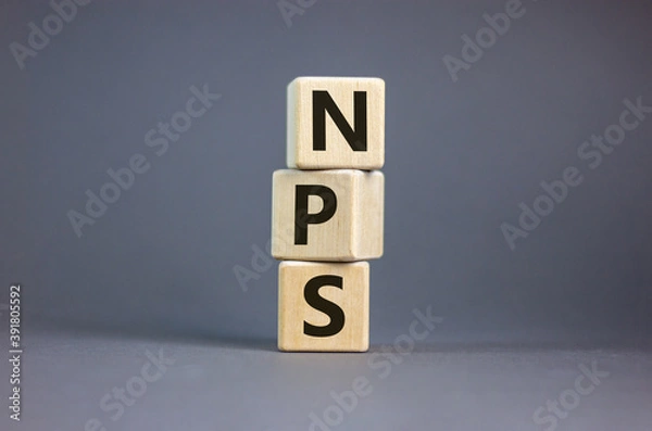 Fototapeta Wood cubes with acronym 'NPS' - 'net promoter score' on a beautiful grey background. Business concept, copy space.
