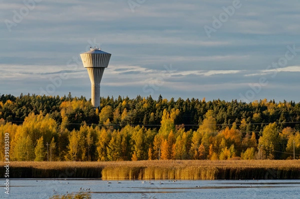 Fototapeta Water tower on the lake in autumn.