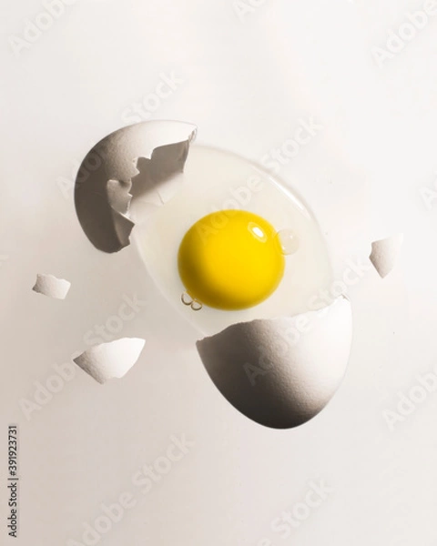 Obraz broken egg on a white background levitation