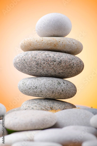 Fototapeta Balanced pebbles with colour background