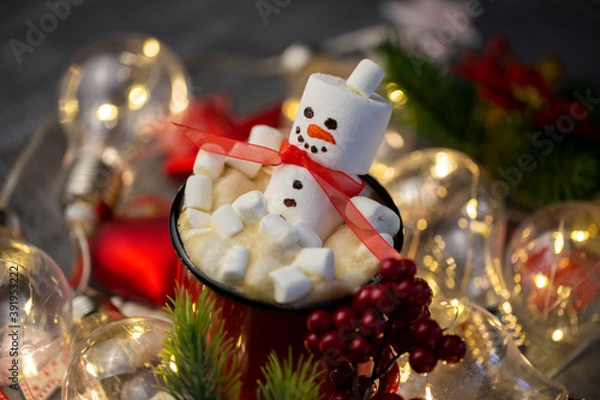 Fototapeta a marshmallow snowman with a red coffee Cup in a close-up Christmas decoration