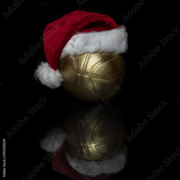 Obraz Basketball ball with a Santa hat on his head