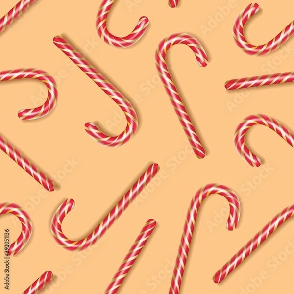 Fototapeta Candy cane - seamless pattern, a symbol of the new year and christmas. Caramel on a yellow background. Festive wallpaper. Vector illustration