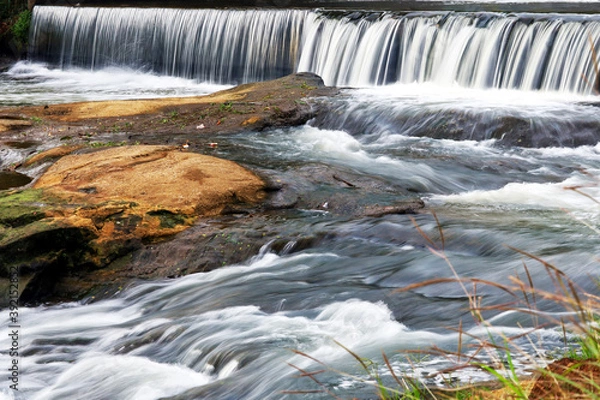 Obraz Water fall and river flow represent the never stop spirit in pandemic