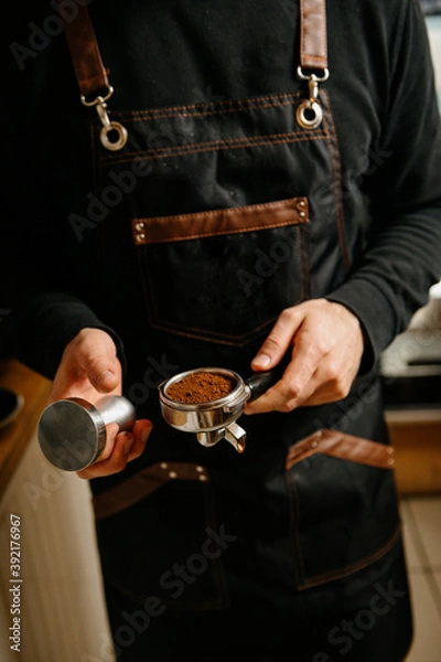 Obraz a person is making coffee