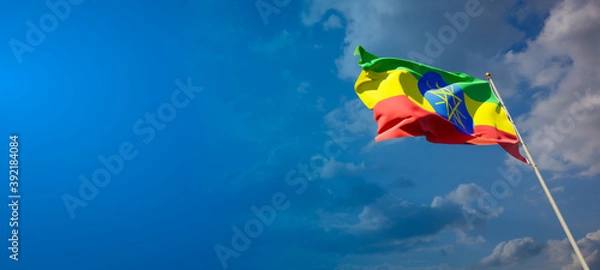 Fototapeta Beautiful national state flag of Ethiopia with blank space. Ethiopia flag on wide background with place for text 3D artwork.