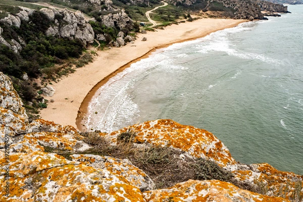 Obraz Mountains of steel and stones on the seashore. Wild beach. holidays, privacy,