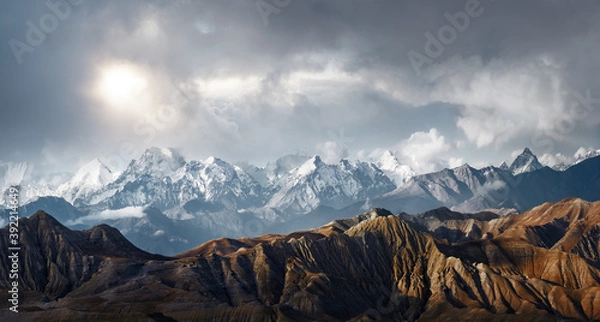 Obraz Panoramic view of the scenic landscape of snowy mountains and dramatic clouds