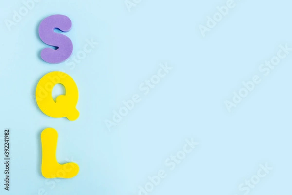 Obraz Structured Query Language. Word sql on blue background. Flat lay, top view, copy space.