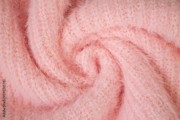 Fototapeta Background of woolen knitted pink warm sweater top view