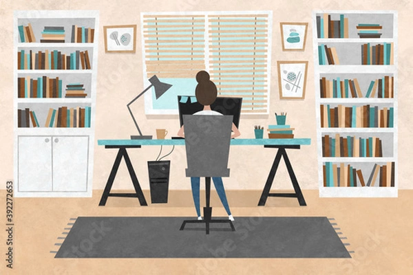 Obraz Young woman sitting at the table and working from home