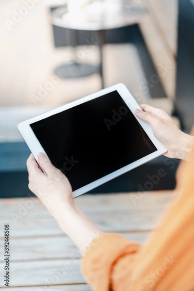 Fototapeta person using tablet computer