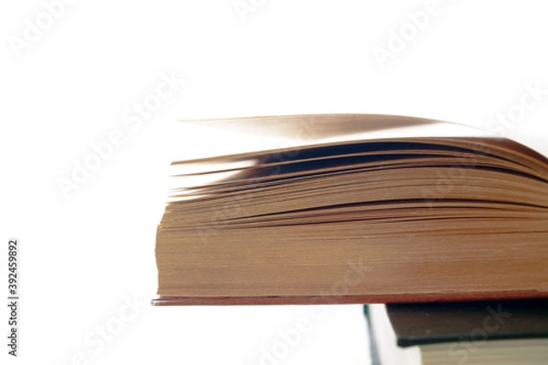 Fototapeta Open book, hardback books on bright colorful background.
