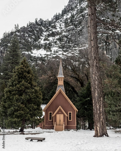 Fototapeta Chapel in winter surrounded with snow in Yosemite National park