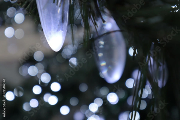 Fototapeta Christmas decorations - multicolored garlands. Selective soft focus. Snowflake from New Year's lanterns.
