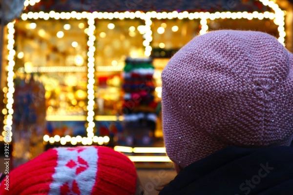 Fototapeta Christmas tree with new year decorations. A shop decorated for the New Year. Selective soft focus.