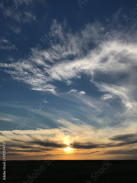 Fototapeta Evening sky with sunset and black field
