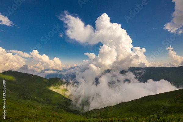 Fototapeta Beautiful mountain landscape at Caucasus mountains with clouds and blue sky