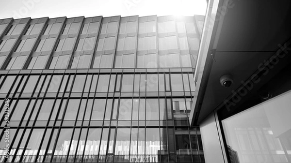 Fototapeta Abstract modern architecture with high contrast black and white tone. Architecture of geometry at glass window - monochrome. Black and white.