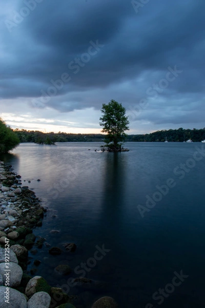Obraz clouds over the river at blue hour