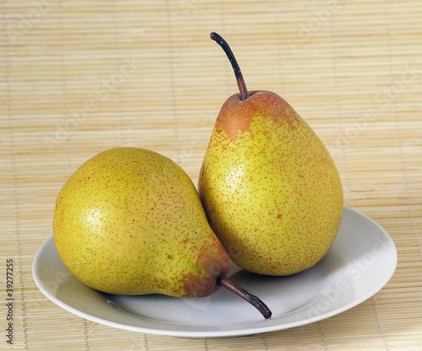 Obraz photo of two pears on a white plate