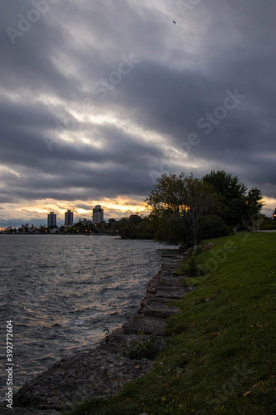 Obraz cloudy sunset over the river